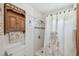 This bathroom showcases a tiled shower and charming wooden accents at 6914 N Ola Ave, Tampa, FL 33604