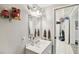 Bathroom with white fixtures, neutral paint, and ample lighting at 6914 N Ola Ave, Tampa, FL 33604