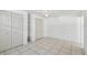 This bedroom offers tile flooring, built-in shelves and storage at 6914 N Ola Ave, Tampa, FL 33604