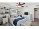 Relaxing bedroom with a ceiling fan, dresser, and a cozy bench offering ample space to unwind at 6914 N Ola Ave, Tampa, FL 33604