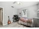 Charming bedroom featuring durable floors, neutral walls, and a window for a bright and airy space at 6914 N Ola Ave, Tampa, FL 33604
