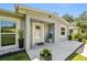 Inviting front porch with stylish potted plants and modern accents at 6914 N Ola Ave, Tampa, FL 33604