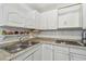 The kitchen includes practical appliances and countertops at 6914 N Ola Ave, Tampa, FL 33604