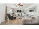 Inviting living room with neutral tones, wood floors, and a decorative fireplace at 6914 N Ola Ave, Tampa, FL 33604