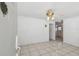 Welcoming living room with tiled floor, ceiling fan, and open layout offering ample space at 6914 N Ola Ave, Tampa, FL 33604