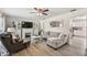 Comfortable living room with a fireplace, stylish decor, and wood-look flooring at 6914 N Ola Ave, Tampa, FL 33604