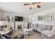 Charming living room featuring a fireplace, ample seating, and an open layout at 6914 N Ola Ave, Tampa, FL 33604