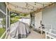 Covered patio with string lights and furniture, perfect for outdoor entertaining at 6914 N Ola Ave, Tampa, FL 33604