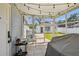 Screened in patio with tiled floor, providing a comfortable outdoor space at 6914 N Ola Ave, Tampa, FL 33604