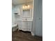 Bathroom view includes a tub/shower, toilet, vanity, mirror, and neutral paint at 10627 Mira Vista Dr, Port Richey, FL 34668