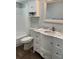 Bathroom featuring a tub/shower, toilet, vanity with a marble countertop and decorative mirror at 10627 Mira Vista Dr, Port Richey, FL 34668