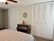 Spacious bedroom featuring a ceiling fan and ample closet storage at 10627 Mira Vista Dr, Port Richey, FL 34668