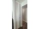 Hallway closet with louvered doors, offering ample storage space at 10627 Mira Vista Dr, Port Richey, FL 34668