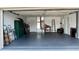 A spacious and organized garage featuring tools, storage cabinets, and ample room for vehicles or hobbies at 10627 Mira Vista Dr, Port Richey, FL 34668