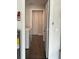 A well-organized laundry area featuring a modern washer and dryer with a hallway leading to closet at 10627 Mira Vista Dr, Port Richey, FL 34668
