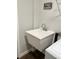 Close up of the laundry sink with modern faucet in a bright, tiled laundry area with white walls at 10627 Mira Vista Dr, Port Richey, FL 34668