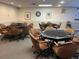 Poker room features multiple tables and comfortable seating creating an inviting social atmosphere at 10627 Mira Vista Dr, Port Richey, FL 34668