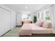 Primary bedroom with natural light and comfortable seating at 10716 Donbrese Ave, Tampa, FL 33615