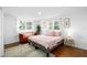Bright bedroom with large windows and comfortable seating area at 10716 Donbrese Ave, Tampa, FL 33615