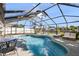 Screened-in pool area with a lounge area and canal view, perfect for relaxation at 10716 Donbrese Ave, Tampa, FL 33615