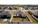 Aerial view of a fenced backyard with playset and neighborhood; perfect for Gathering living and privacy at 1102 Wynnmere Walk Ave, Ruskin, FL 33570