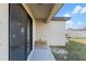Cozy back patio with sliding door, small bench, and outdoor grill, perfect for relaxation and entertaining at 1102 Wynnmere Walk Ave, Ruskin, FL 33570
