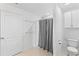 Clean bathroom with enclosed shower, tile floors, and an efficient toilet at 1102 Wynnmere Walk Ave, Ruskin, FL 33570