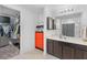 Bathroom with a walk-in closet, vanity with modern cabinets, and an enclosed shower at 1102 Wynnmere Walk Ave, Ruskin, FL 33570