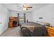 Bedroom featuring carpet, a ceiling fan, window, and a desk at 1102 Wynnmere Walk Ave, Ruskin, FL 33570
