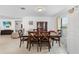 This dining room features tile floors, six chairs, and a traditional china cabinet for storage at 1102 Wynnmere Walk Ave, Ruskin, FL 33570