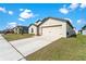 Charming home with a well-manicured lawn and a spacious two-car garage at 1102 Wynnmere Walk Ave, Ruskin, FL 33570