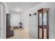 Foyer featuring neutral tile flooring and dark wood furniture and trim at 1102 Wynnmere Walk Ave, Ruskin, FL 33570