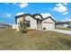 Well-kept home with a two-car garage, manicured landscaping, and inviting curb appeal at 1102 Wynnmere Walk Ave, Ruskin, FL 33570