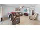 Inviting living room with plush seating, a ceiling fan, and a mounted television for relaxation at 1102 Wynnmere Walk Ave, Ruskin, FL 33570