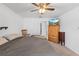 Cozy bedroom with carpet, ceiling fan, TV, and easy access to closet at 1102 Wynnmere Walk Ave, Ruskin, FL 33570
