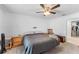 Comfortable bedroom featuring neutral walls and carpet, ceiling fan, and closet access at 1102 Wynnmere Walk Ave, Ruskin, FL 33570