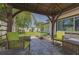 Relaxing back patio with shade covering and backyard view at 1150 7Th Ne Ave, Largo, FL 33770