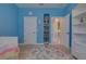 Cozy bedroom with built-in bookcase in wall and a colorful rug at 1150 7Th Ne Ave, Largo, FL 33770