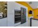 Modern kitchen with stainless steel appliances and sleek white cabinetry at 1150 7Th Ne Ave, Largo, FL 33770