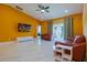 Inviting living room with hardwood floors and a bright accent wall at 1150 7Th Ne Ave, Largo, FL 33770