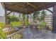 Outdoor patio lounge featuring pavers, covered lounge and ample seating at 1150 7Th Ne Ave, Largo, FL 33770