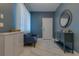 Sitting room with modern decor including grey walls, white marble floors, and stylish furniture at 1150 7Th Ne Ave, Largo, FL 33770