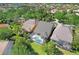 Aerial view of property showing the pool and surrounding greenery at 11644 Meridian Point Dr, Tampa, FL 33626