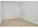 Neutral bedroom with carpet, a window with shutter-style blinds, and a closet at 11644 Meridian Point Dr, Tampa, FL 33626