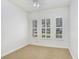 Bright, neutral bedroom with three windows, ceiling fan, and plush carpet flooring at 11644 Meridian Point Dr, Tampa, FL 33626