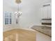 Sun-filled breakfast nook with chandelier and large windows with shutter-style blinds at 11644 Meridian Point Dr, Tampa, FL 33626