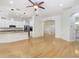 Bright and airy kitchen featuring a breakfast bar, stainless steel appliances, pendant lighting, and hardwood floors at 11644 Meridian Point Dr, Tampa, FL 33626