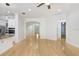 Spacious living room showcasing hardwood floors and open access to other areas of the home at 11644 Meridian Point Dr, Tampa, FL 33626