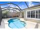 Enjoy a refreshing swim in this lovely kidney-shaped pool surrounded by a screened enclosure at 11644 Meridian Point Dr, Tampa, FL 33626