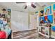 Bedroom with hardwood floors and lots of paintings at 12020 66Th Ave, Seminole, FL 33772